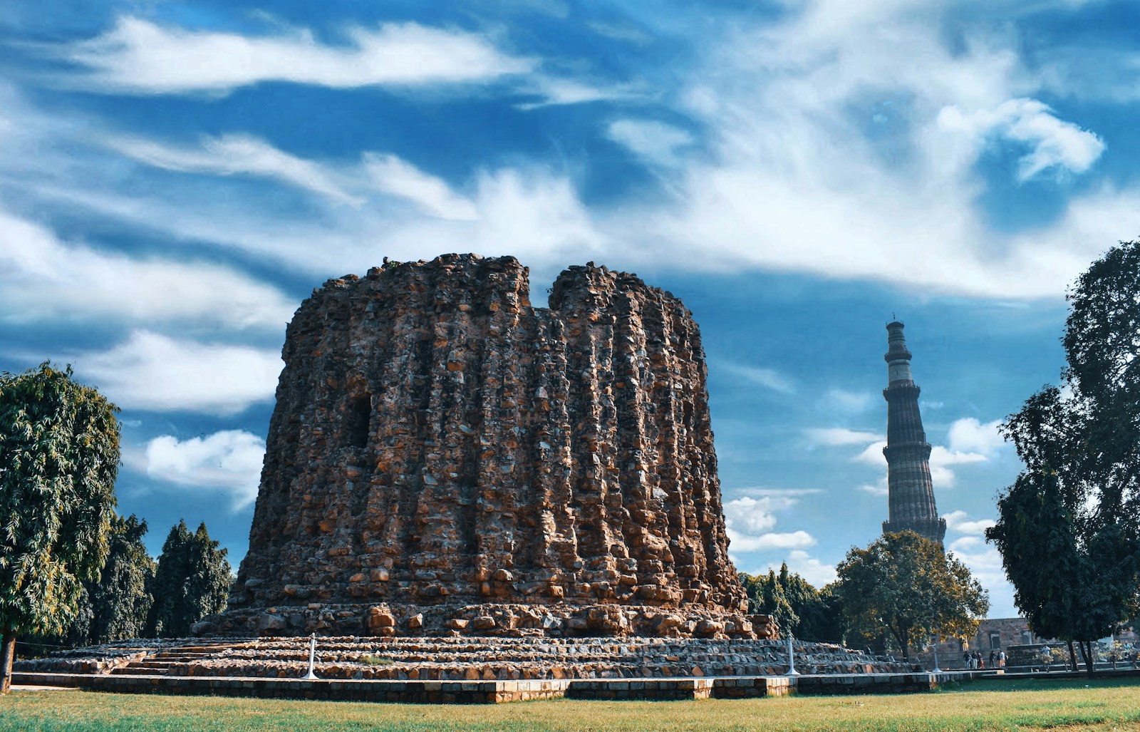 a large stone structure sitting in the middle of a field