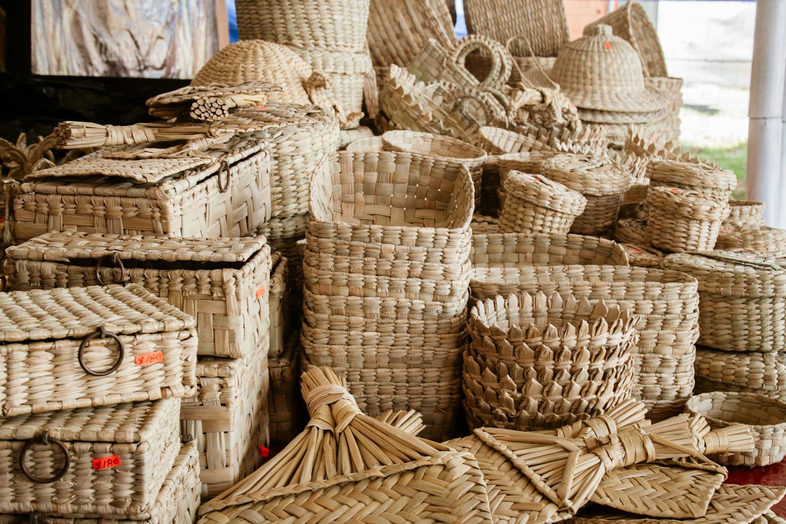 A variety of artisanal woven baskets displayed with intricate textures and designs.